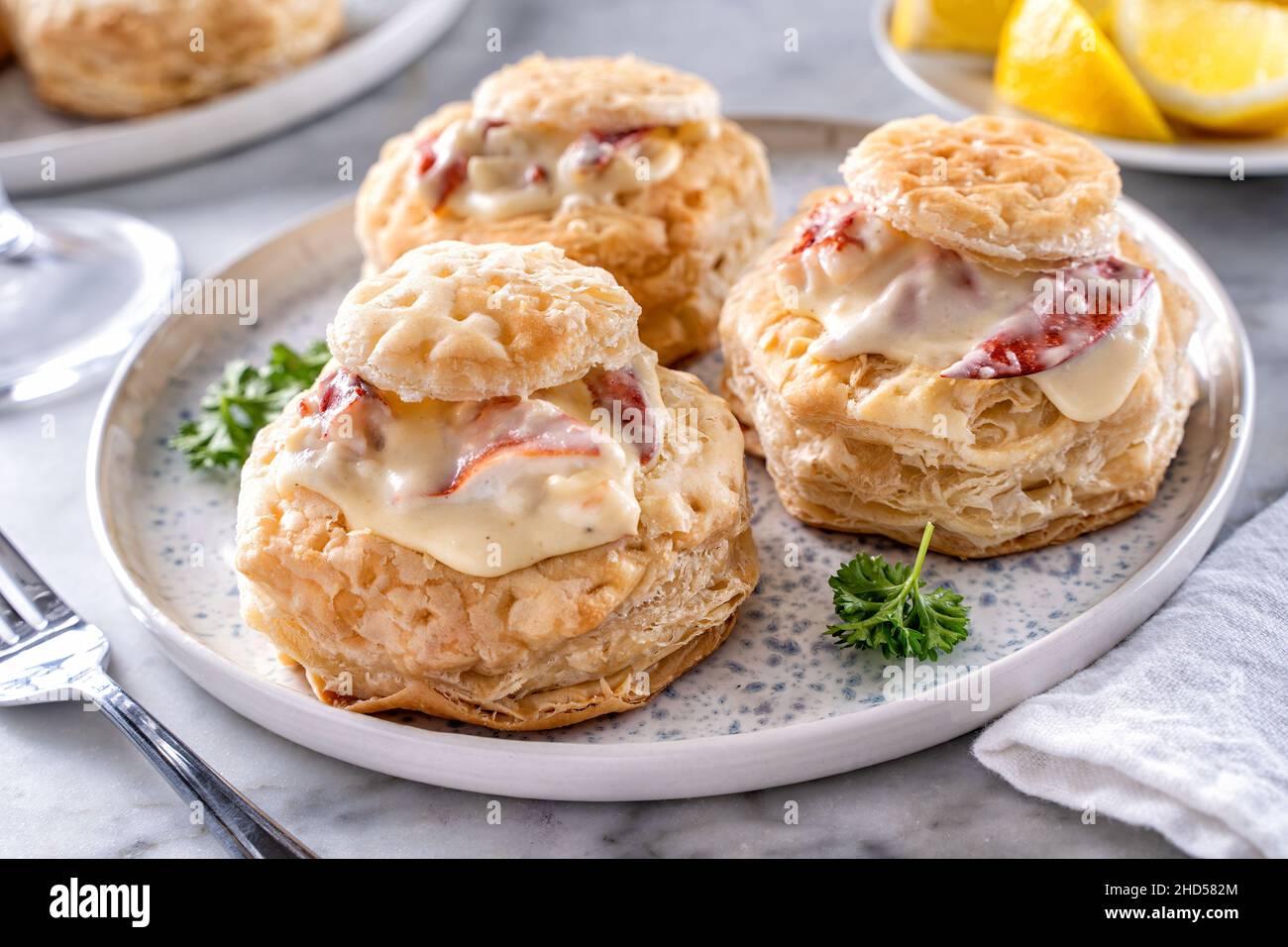 Delicious creamy lobster newburg served in puff pastry shells. Stock Photo