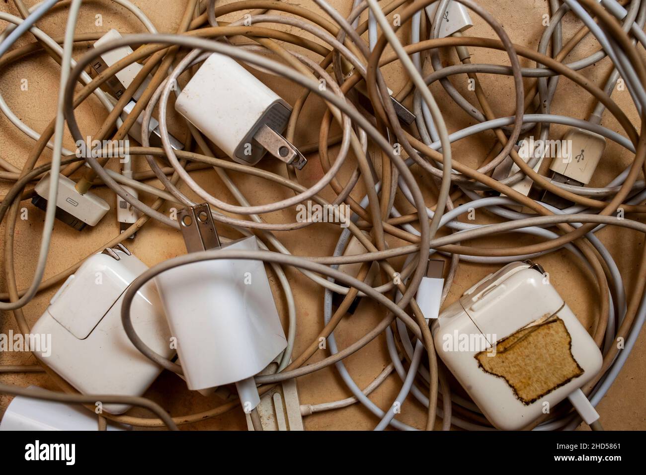 A ÒratÕs nestÓ of various power cords for Apple Computer products in a