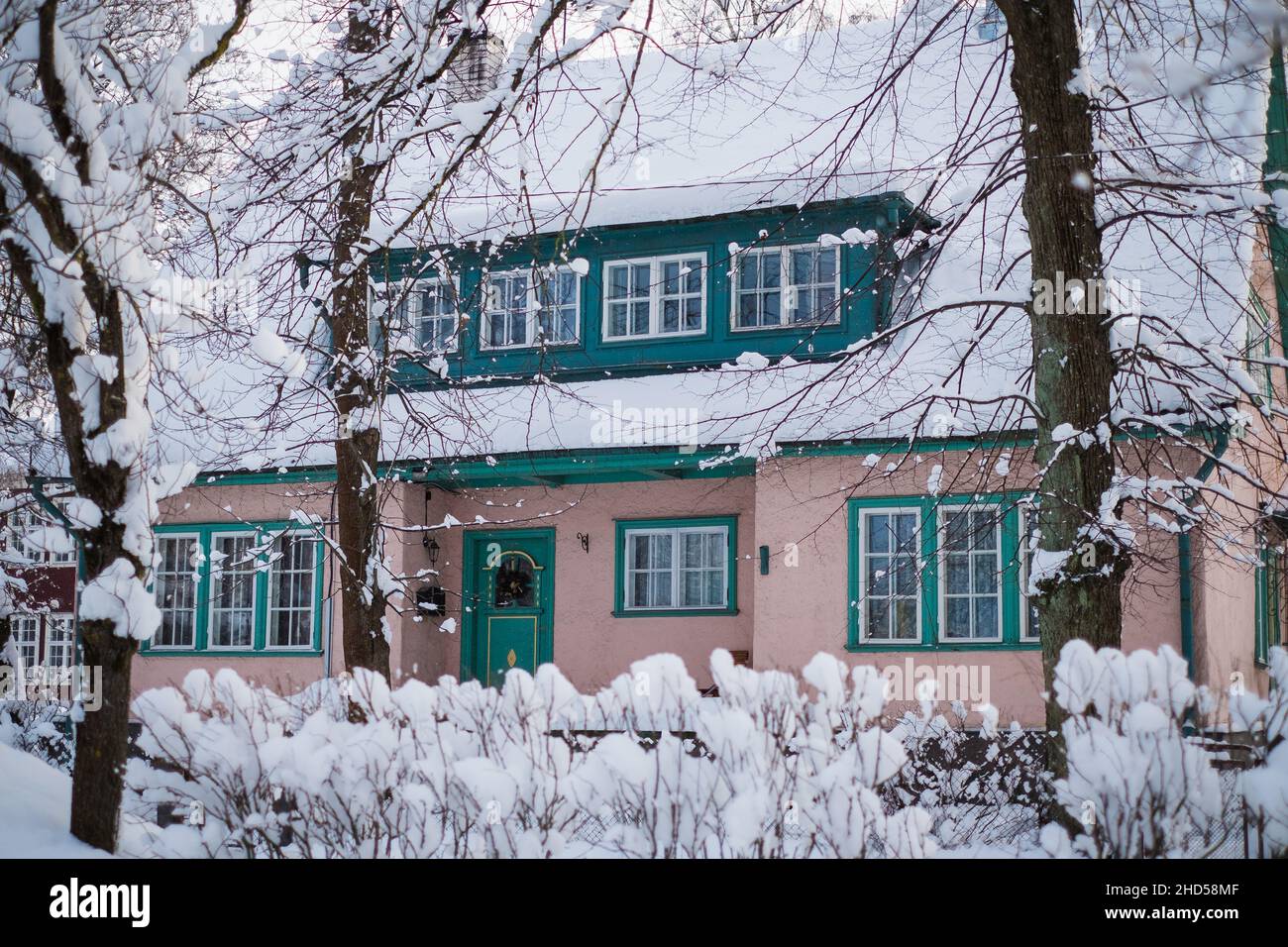 Beautiful renovated old building in snow. Cold and beautiful winter weather in European suburb. Stock Photo