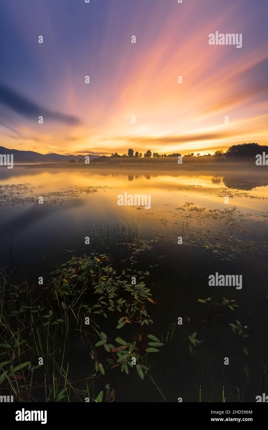 Vertical shot of beautiful sunset sky reflection to the lake Stock ...