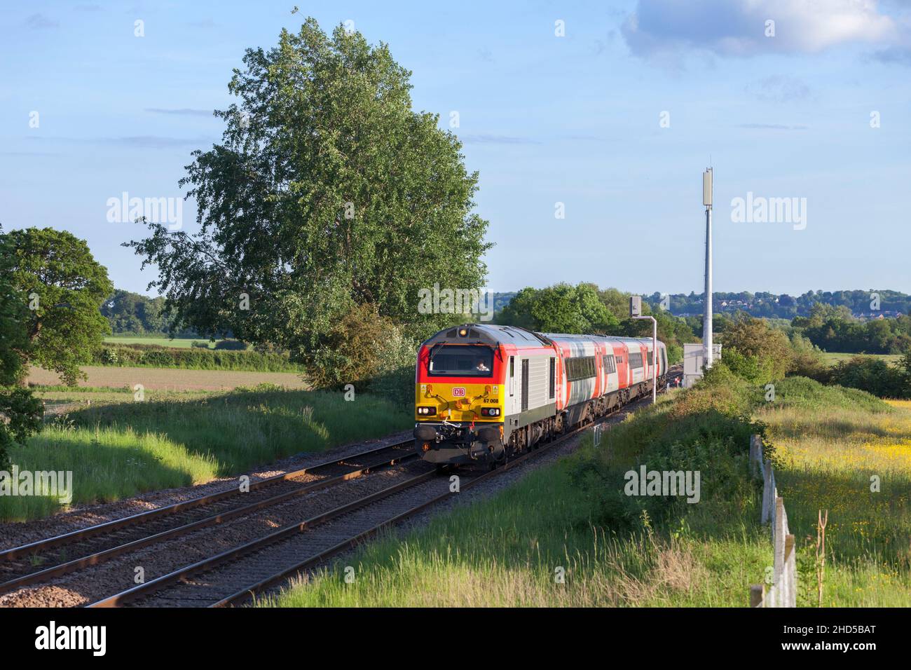 The Gerald of Wales Holyhead to Cardiff 'WAG' express (1716 Cardiff  to Holyhead ) passing Pulford (north of Wrexham) with a DB cargo class 67 loco Stock Photo
