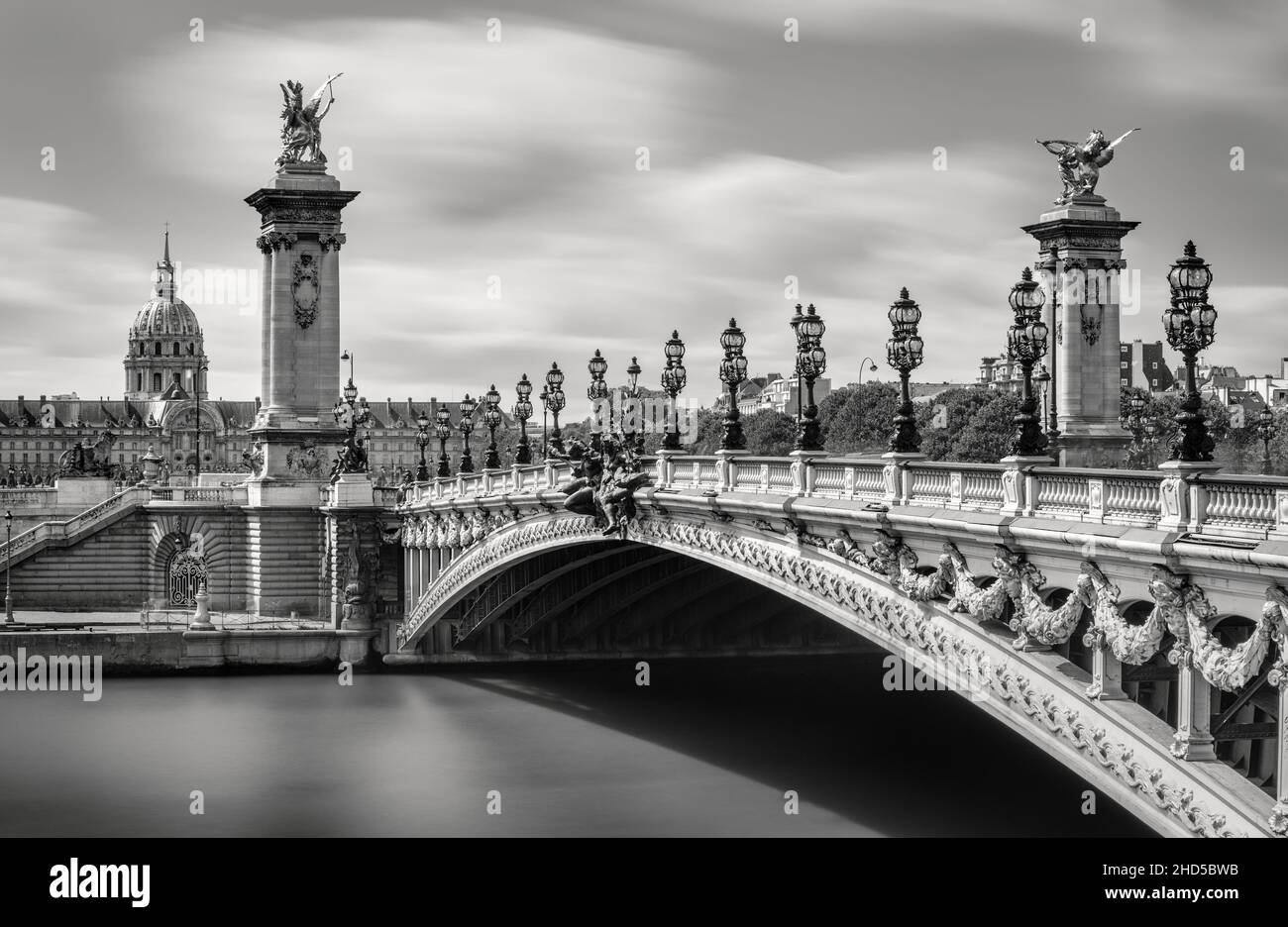 Pont Alexandre III Bridge over the Seine River with view of the Invalides in Black & White (UNESCO World Heritage Site). Paris, France Stock Photo