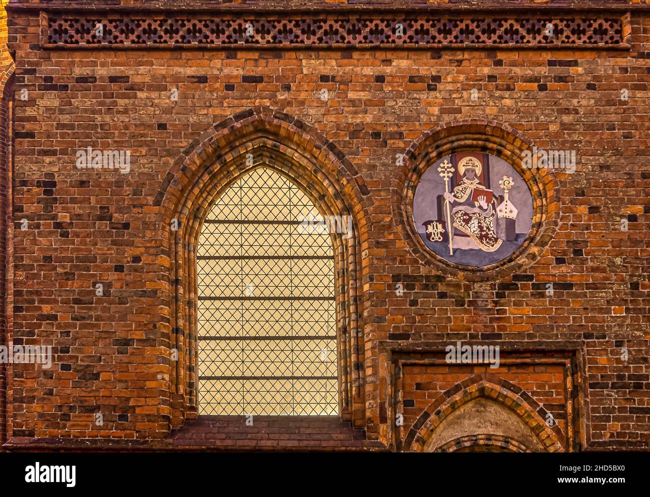 emblem of the bishop of Roskilde on the brickwall of the cathedral, Roskilde, Denmark, January 1, 2022 Stock Photo