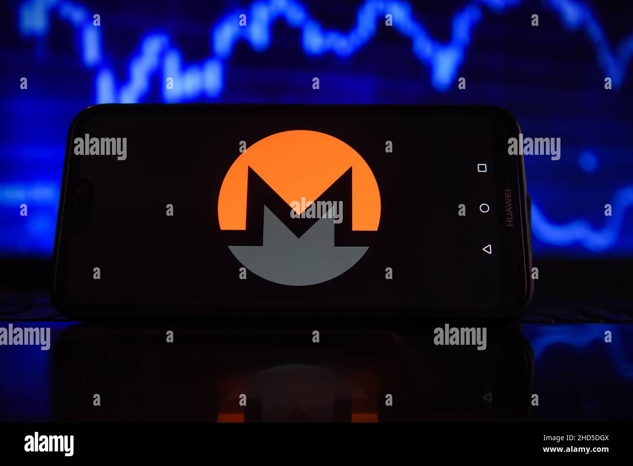 In this photo illustration a Monero logo seen displayed on a smartphone ...