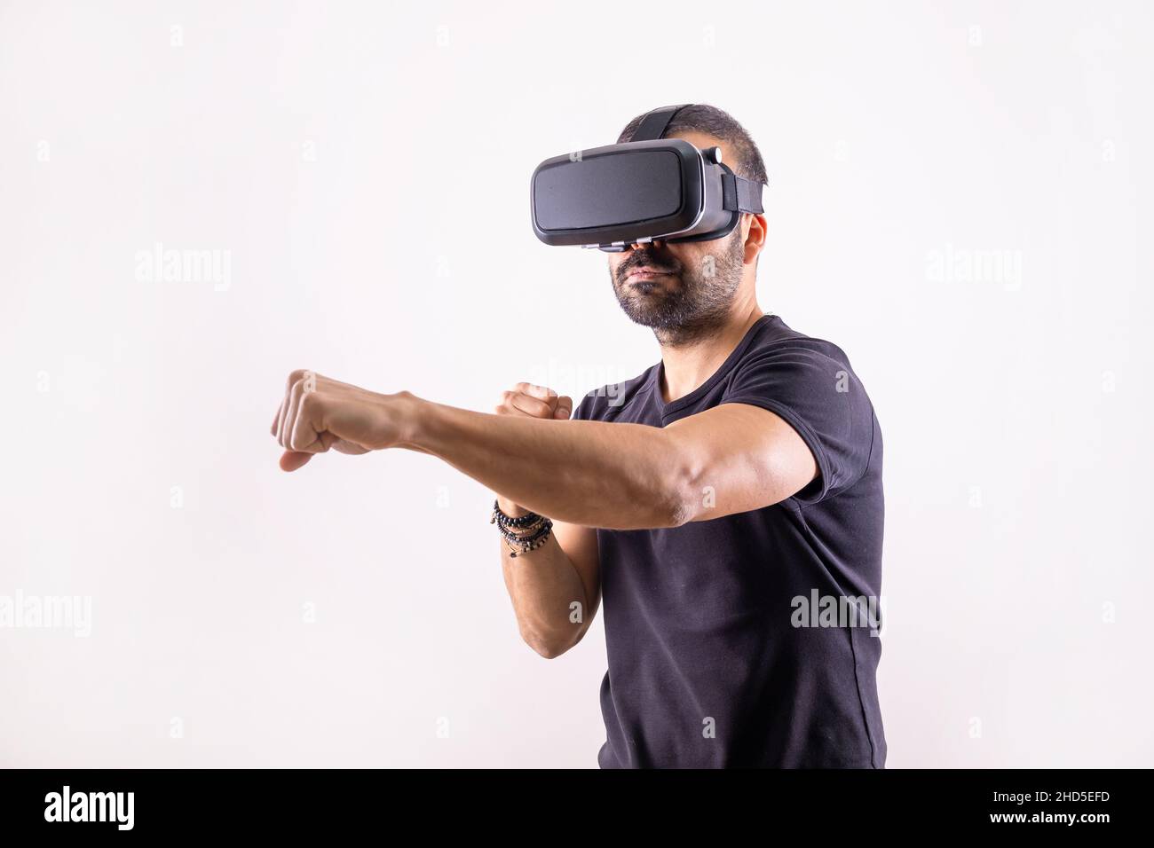 Virtual reality workout, sport game. young man with VR glasses boxing. Smart sport technology