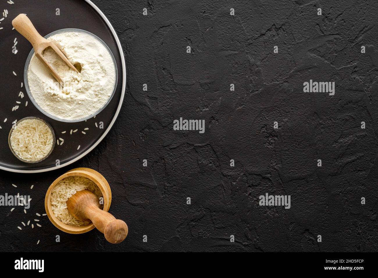 Pestle rice flour grains with mortar on kitchen table Stock Photo Alamy