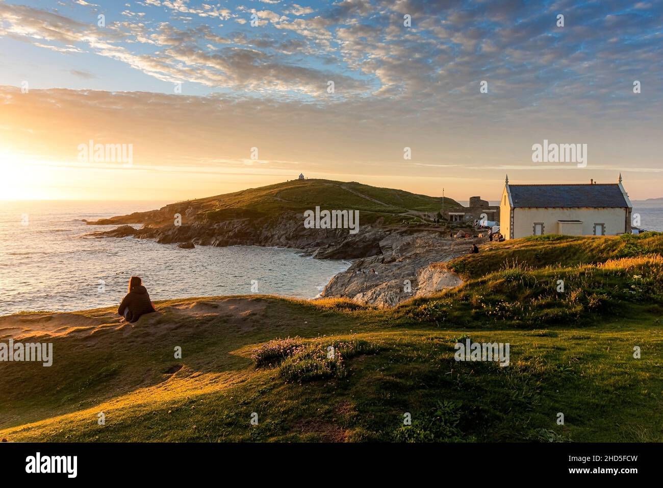 Golden light of an intense sunset over Towan Head on the coast of Newquay in Cornwall. Stock Photo