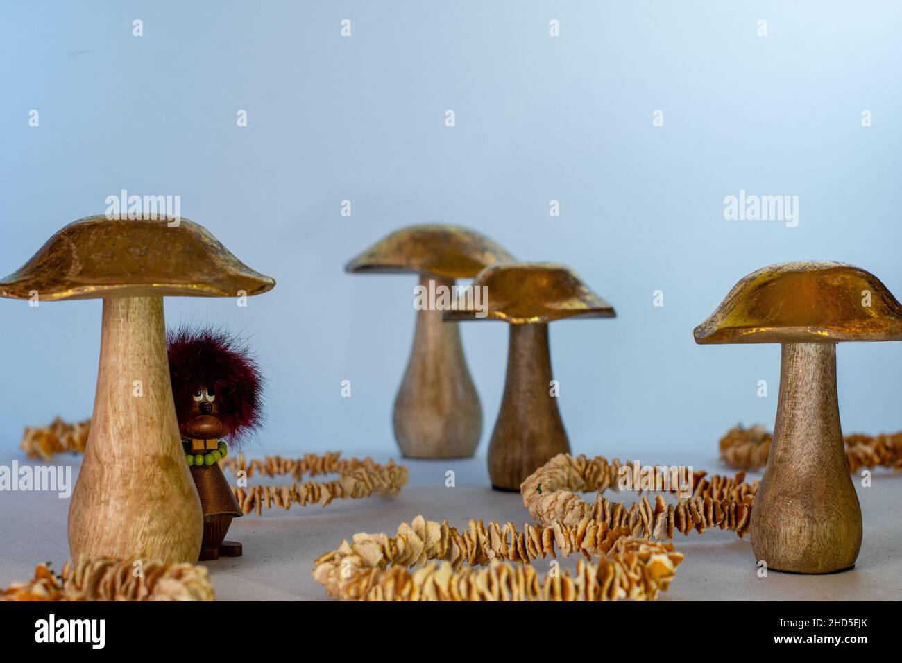 Toy with felt and golden wooden mushroom Stock Photo