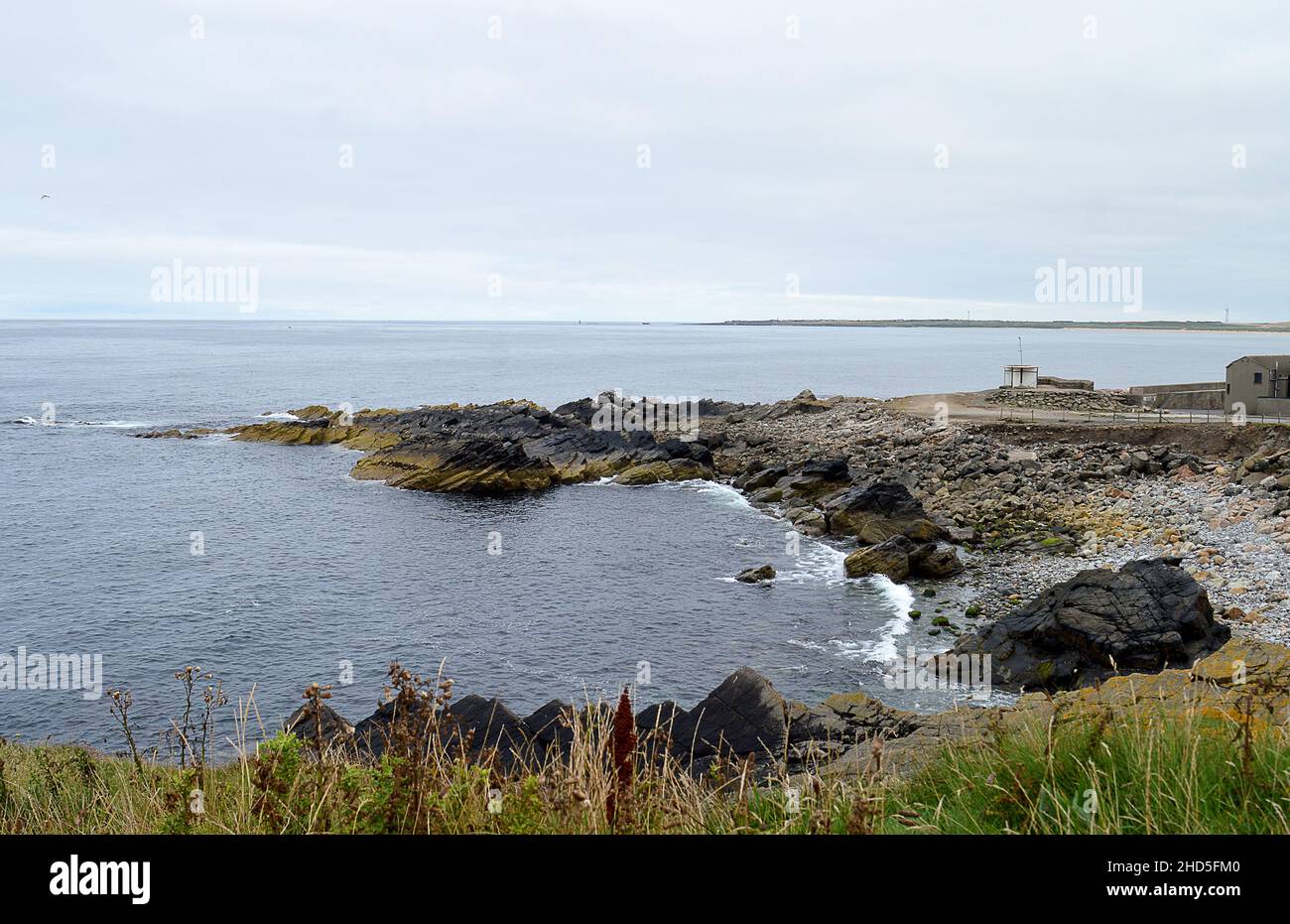 A rocky outcrop in the North Se at: Kinnaird Head, Fraserburgh, Aberdeenshire, Scotland. Stock Photo