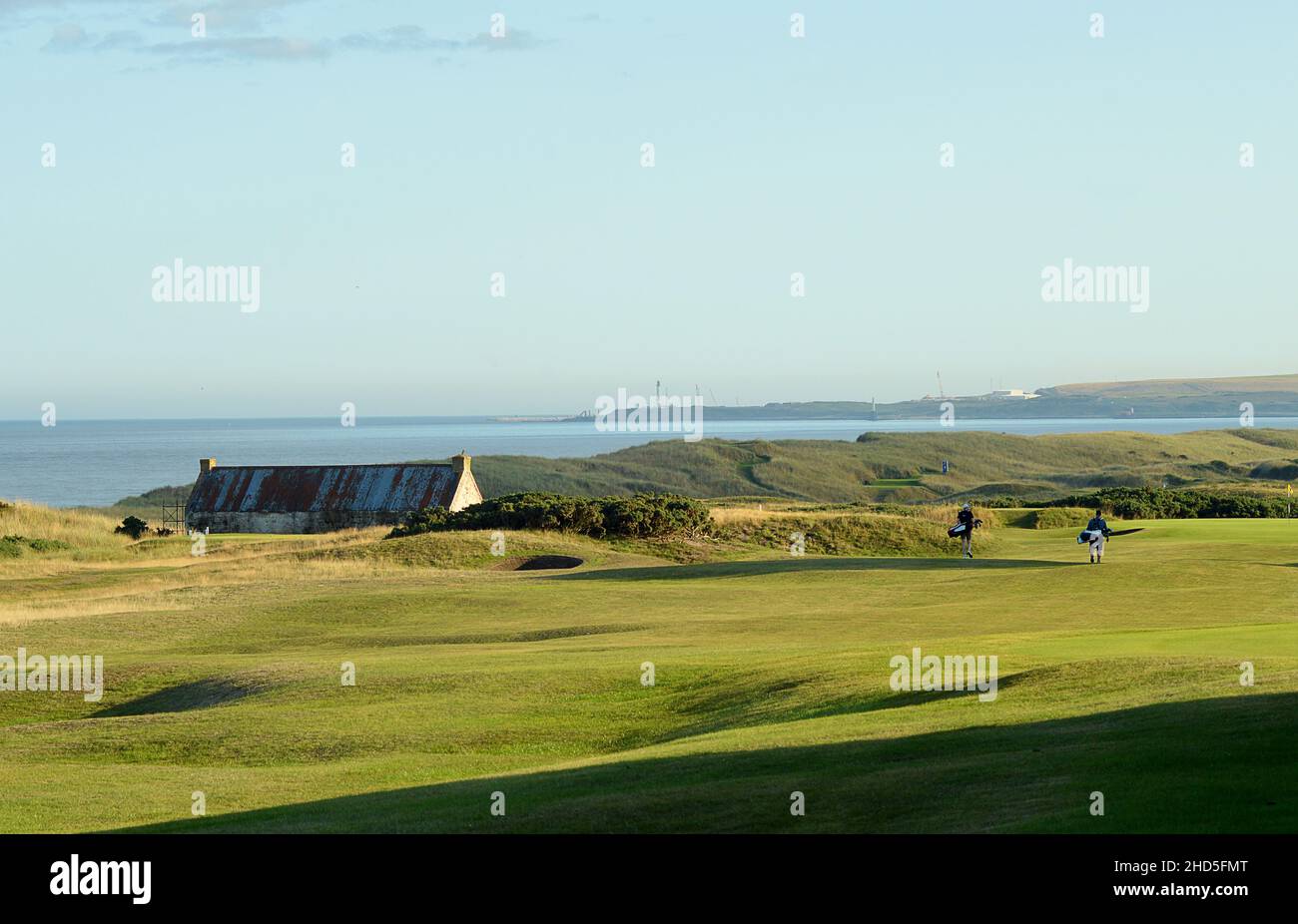 Walking down the fairway on the 1st hole at Murcar Golf Course, 'Bothy' on a summer's evening. Stock Photo