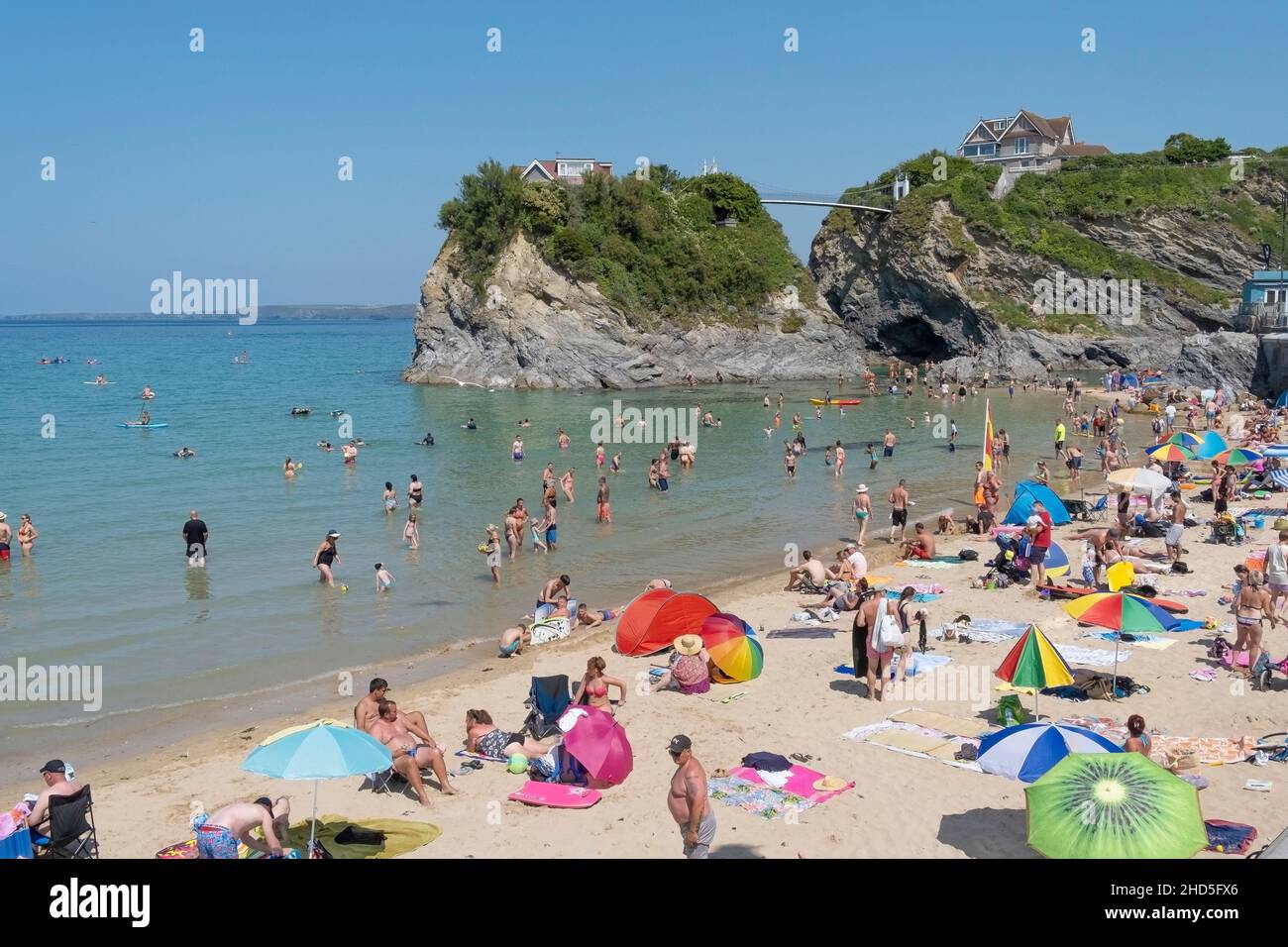 Towan Beach crowded with summer holidaymakers in Newquay in Cornwall. Stock Photo