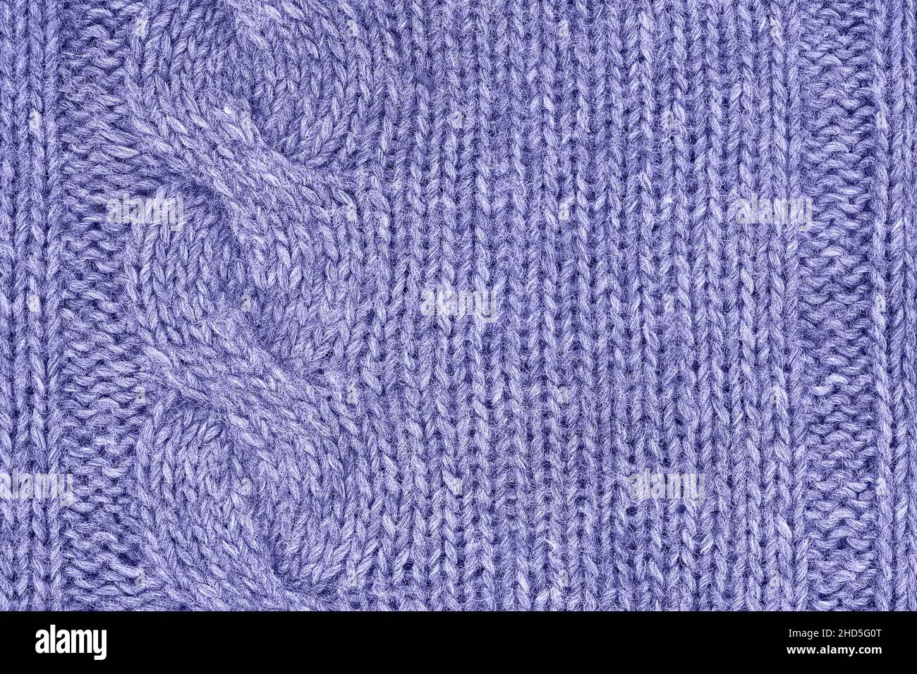 Lilac very peri knitted texture, handmade knitwear. Color of the year 2022 very peri toned Stock Photo