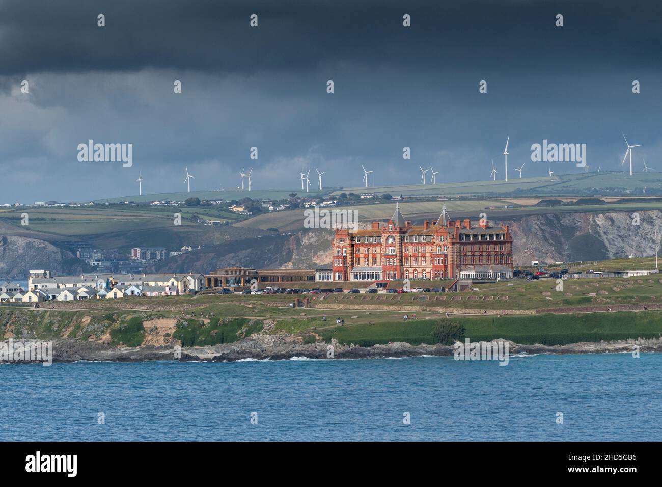A view of the iconic Headland Hotel seen from Pentire Point East across Fistral Bay in Newquay in Cornwall. Stock Photo