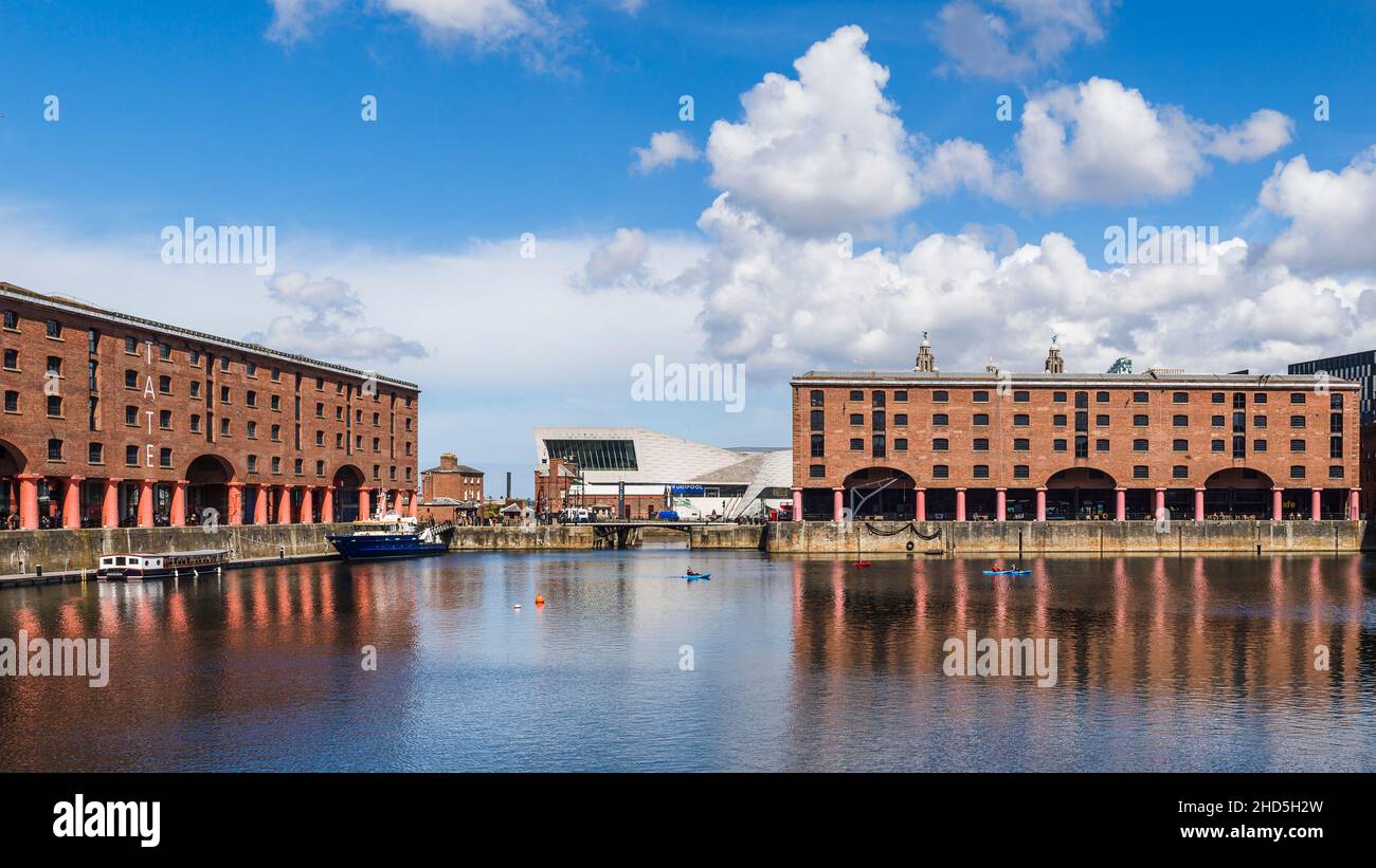 Panorama of canoes on the pretty Albert Dock in front on the world famous Liverpool skyline. Stock Photo
