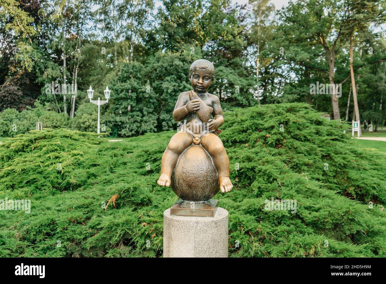 Frantiskovy Lazne, Czech Republic - August 20, 2021.Bronze statue of Frantisek- Boy with Fish,symbol of therapeutic power and popular figure of spa Stock Photo