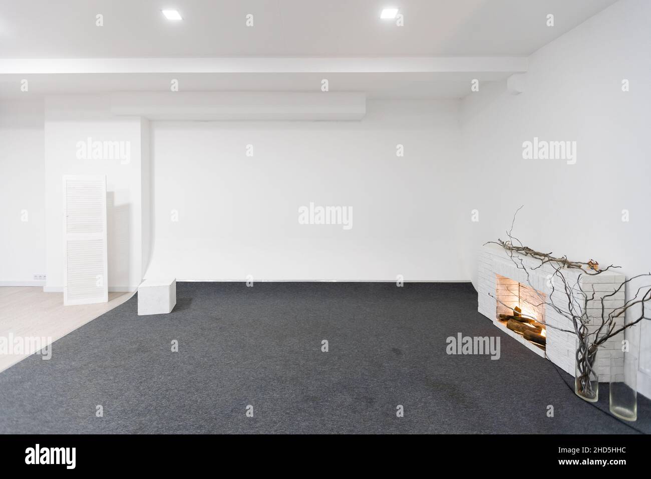 Modern white loft room with big windows and city view Stock Photo