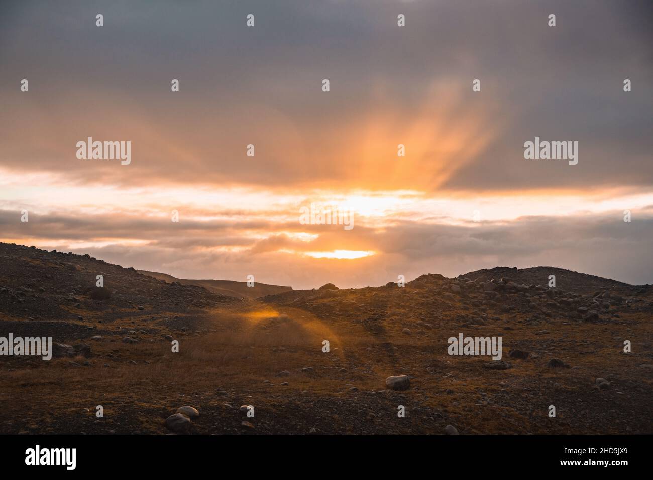 Sun setting over hills in winter in Iceland Stock Photo