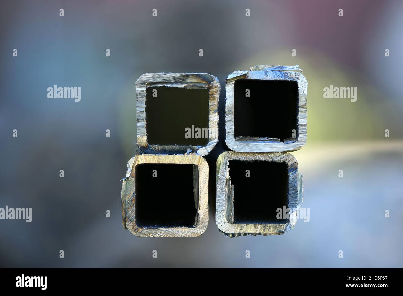 Metal profile pipe cutting. Cut metal pipe with a grinder. High