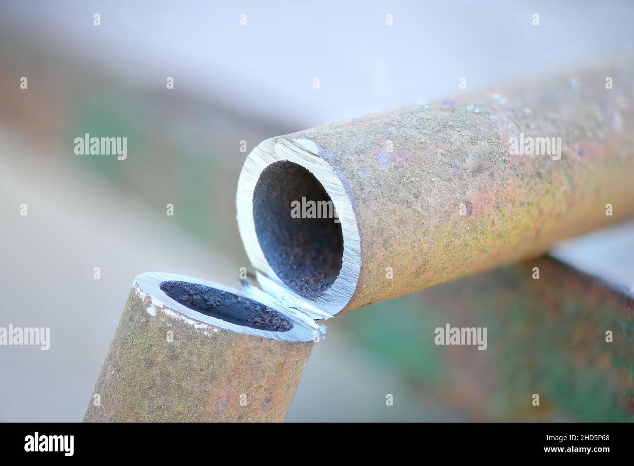 Metal pipe cutting. Cut metal pipe with a grinder. High resolution
