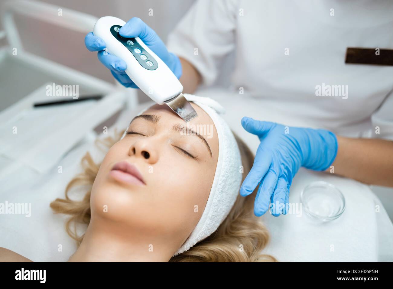 Ultrasonic Scrabbing Beautiful Woman Receiving Ultrasound Cavitation Facial Peeling And