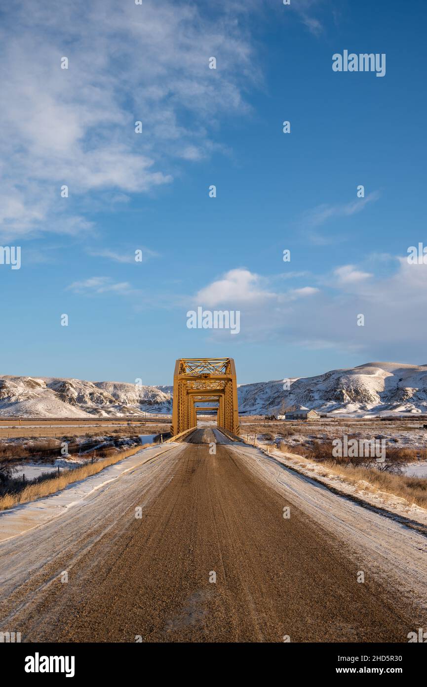 Road and old bridge in the badlands of alberta. Stock Photo