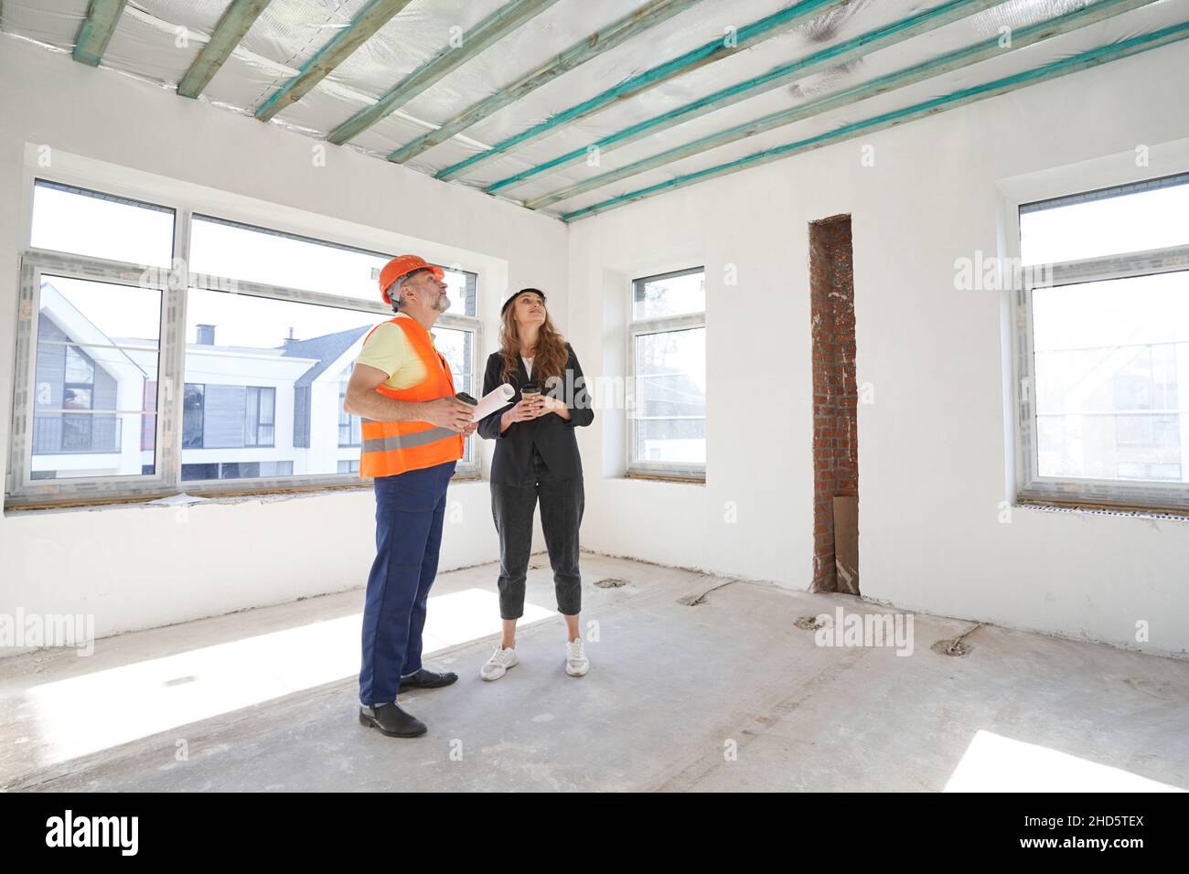Female architect inspecting work hi-res stock photography and images ...