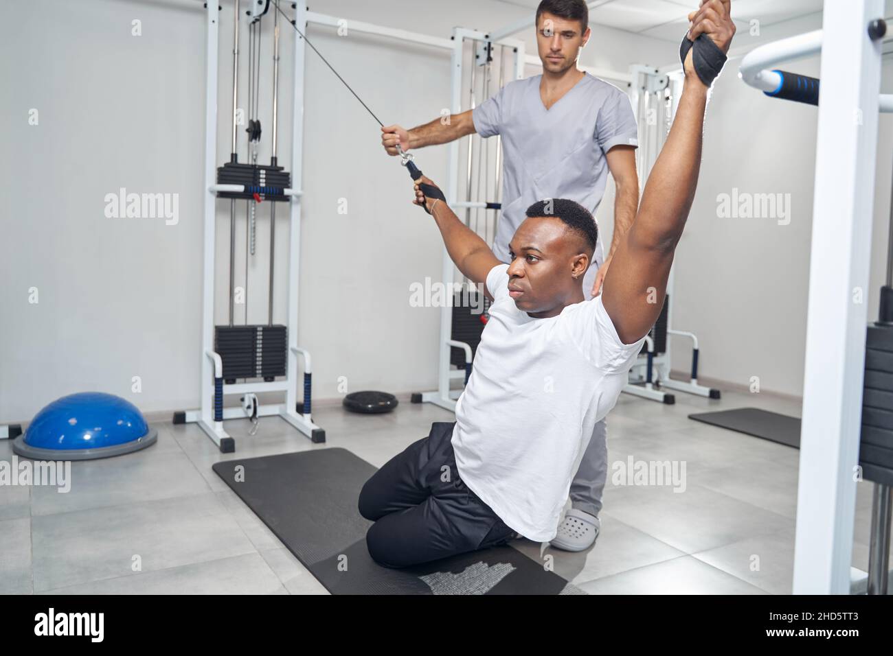 Focused young man stretching in hi-res stock photography and images - Alamy