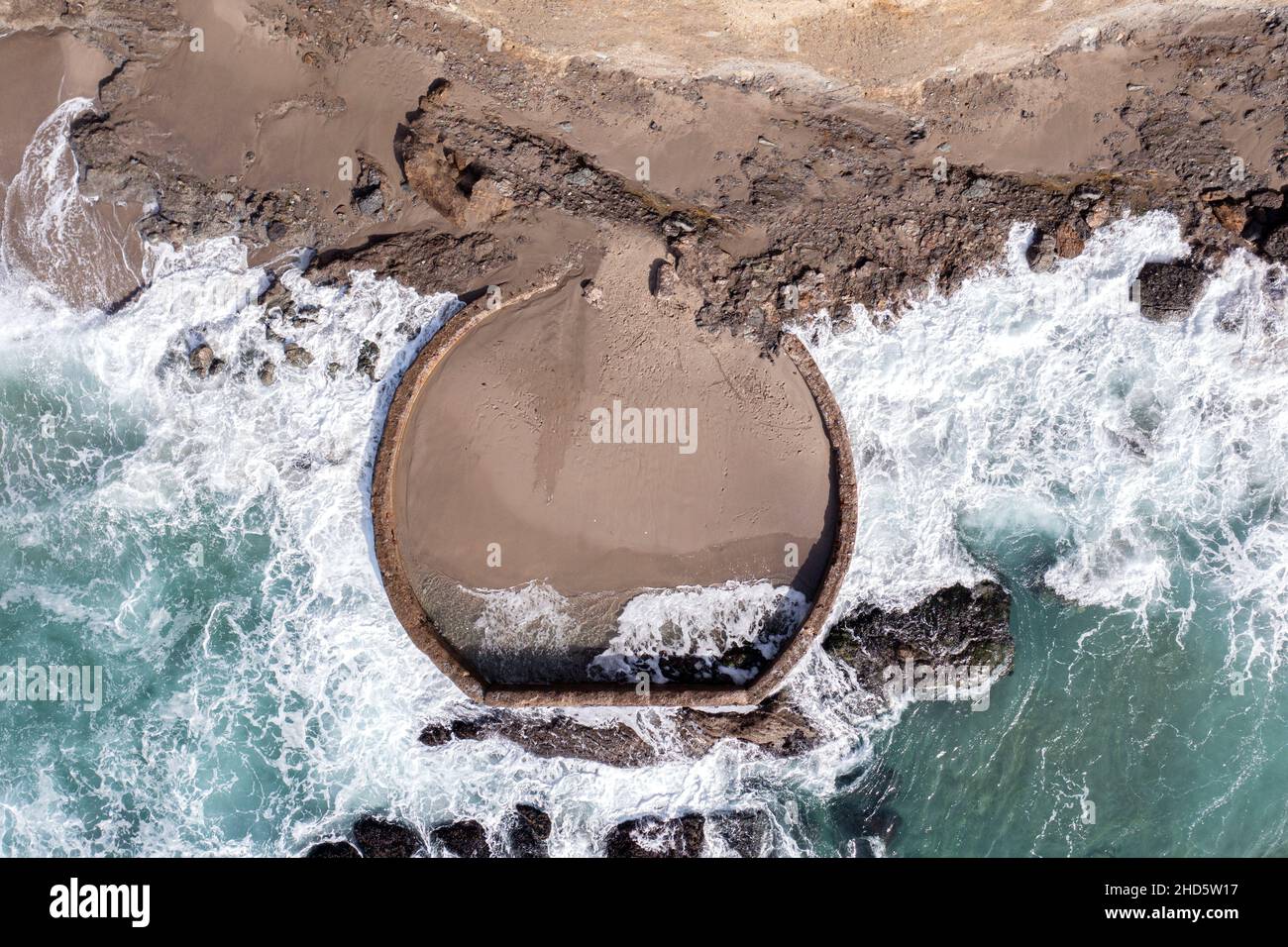 Aerial view of a manmade pool build along the rugged, turbulent shoreline of Laguna Beach California intended to have a safe place to sunbathe in an o Stock Photo