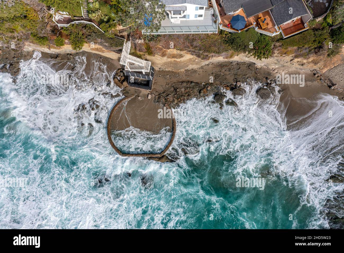 Aerial view of Victoria Beach with the famous pirate's Tower, an area of Orange County California for the wealthy and affluent, shows the crashing wav Stock Photo