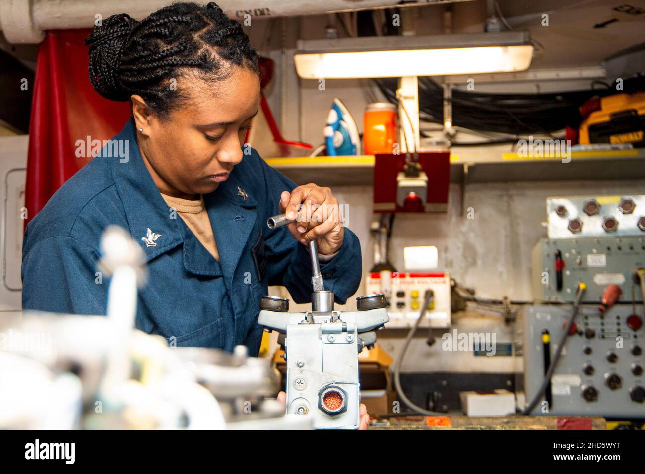 Mediterranean Sea. 2nd Dec, 2021. Aviation Ordnanceman 2nd Class Sharonda Burkes, from Phoenix City, Alabama, tightens a bolt on a BRU-32 bomb ejector for an F/A-18 Super Hornet aboard the Nimitz-class aircraft carrier USS Harry S. Truman (CVN 75), Dec. 27, 2021. The Harry S. Truman Carrier Strike Group is on a scheduled deployment in the U.S. Sixth Fleet area of operations in support of naval operations to maintain maritime stability and security, and defend U.S., allied and partner interests in Europe and Africa. Credit: U.S. Navy/ZUMA Press Wire Service/ZUMAPRESS.com/Alamy Live News Stock Photo