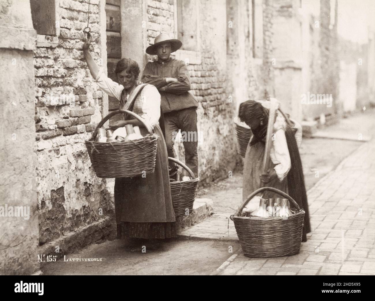 Vintage late 19th century photograph: Milk sellers, street delivery, Italy. Stock Photo