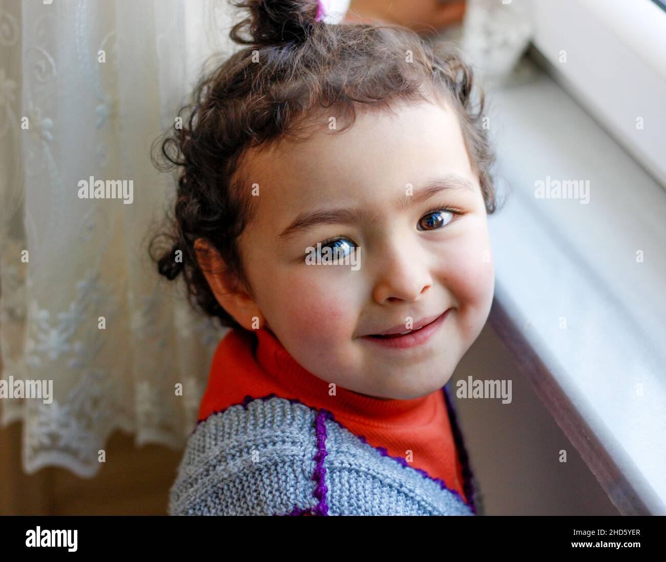 Close up portrait of beautiful little child girl looking at the camera ...
