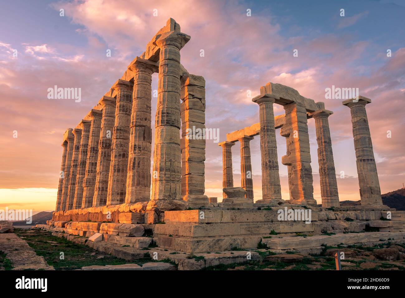 The Temple of Poseidon at Cape Sounion at sunset, over the Aegean Sea ...