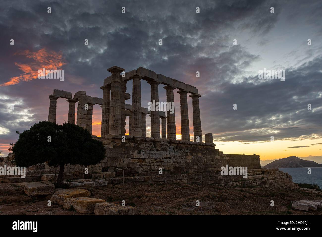 The Temple of Poseidon at Cape Sounion at sunset, over the Aegean Sea ...