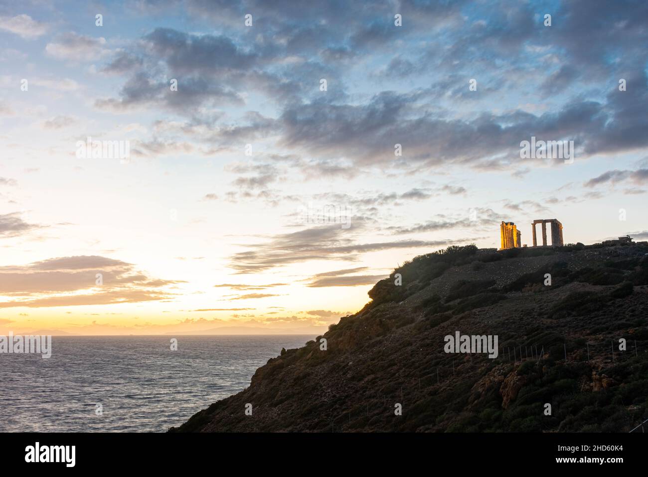 Beautiful sunset over the cliff of The Temple of Poseidon at Cape ...