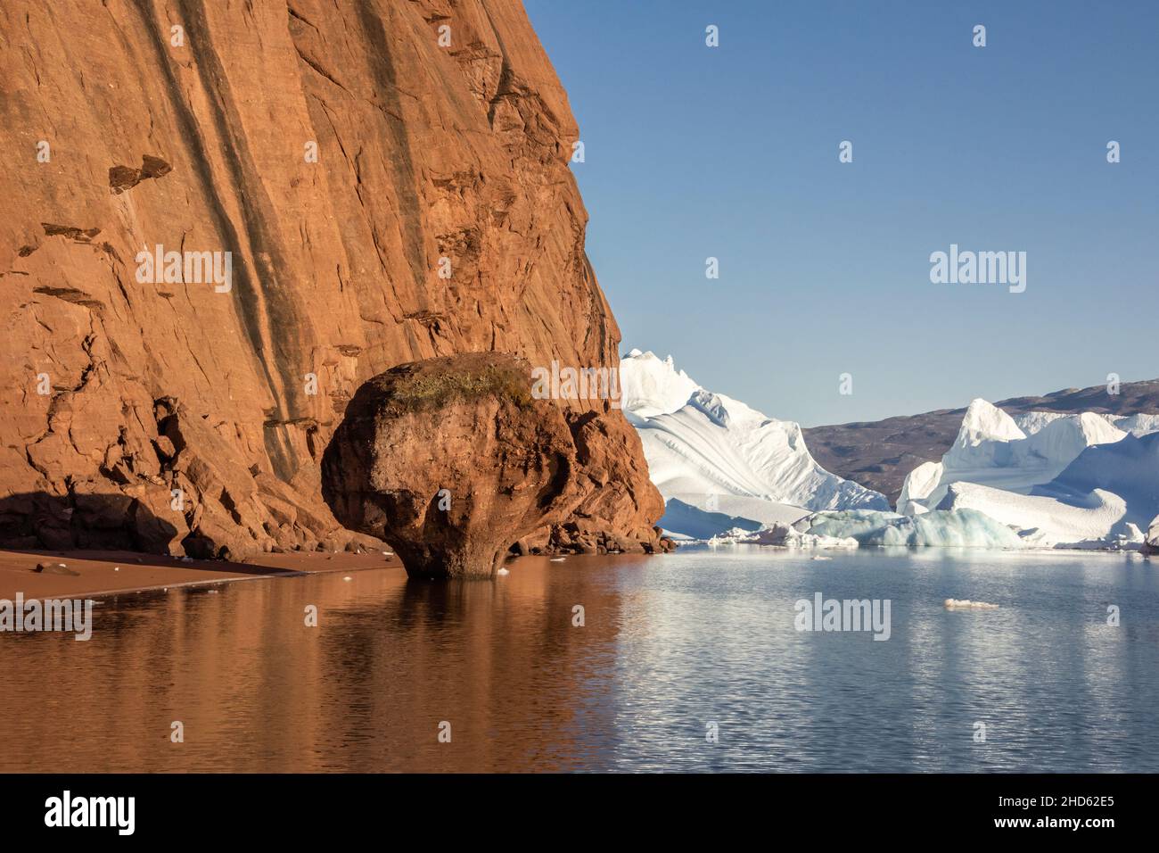 Rock mushroom and stranded icebergs, west side of Rode O by Milne Land, Scoresby Sund, East Greenland Stock Photo
