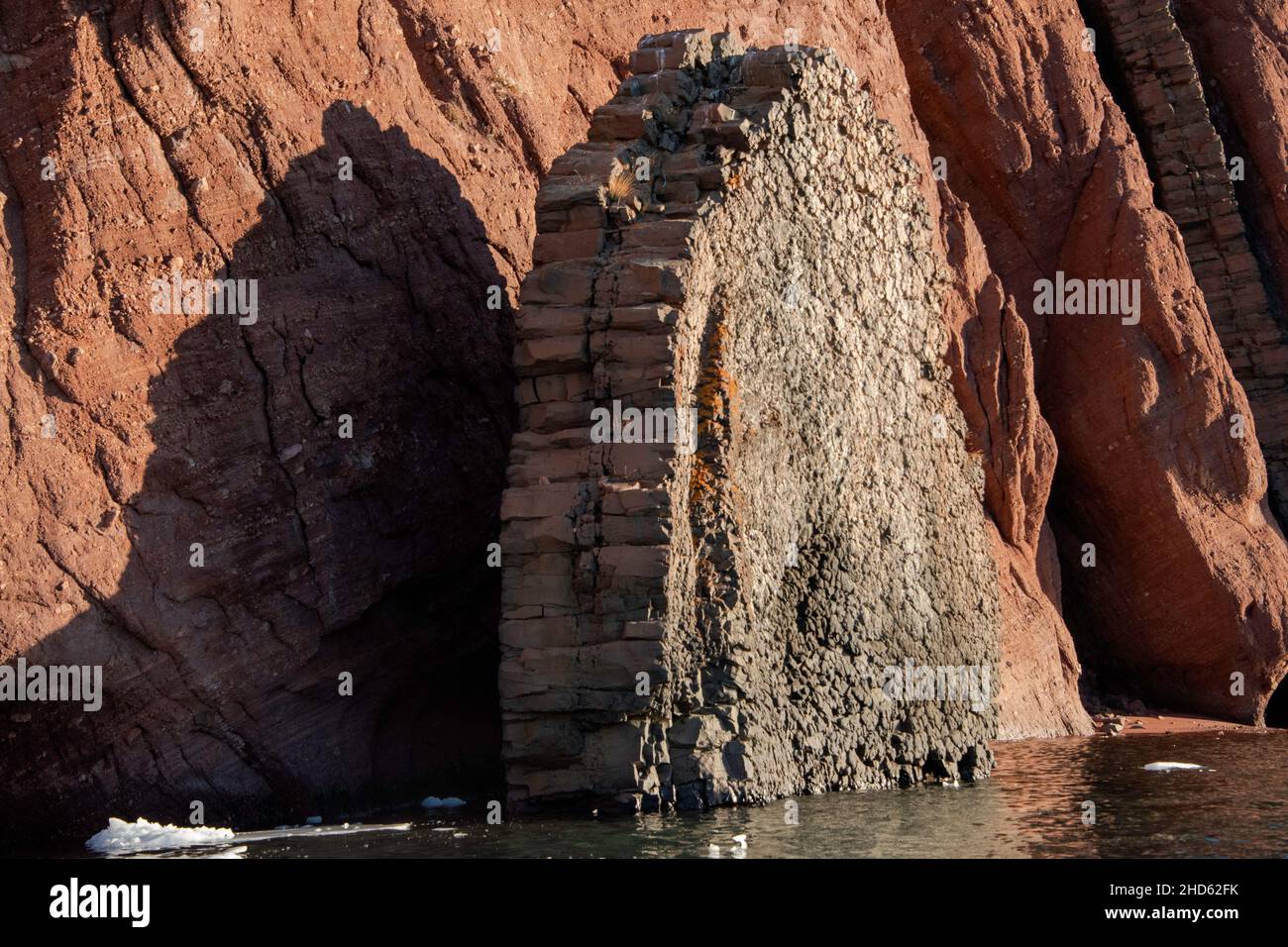 Columnar basaltic dykes, Rode O, Rodefjord, Scoresby Sund, East Greenland Stock Photo