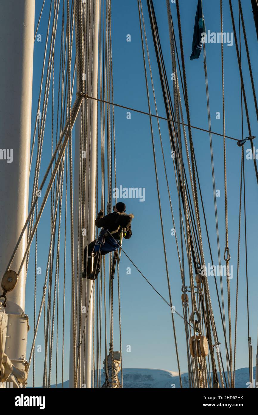 Up the mast for a higher viewpoint, Rodefjord, Scoresby Sund, East Greenland Stock Photo