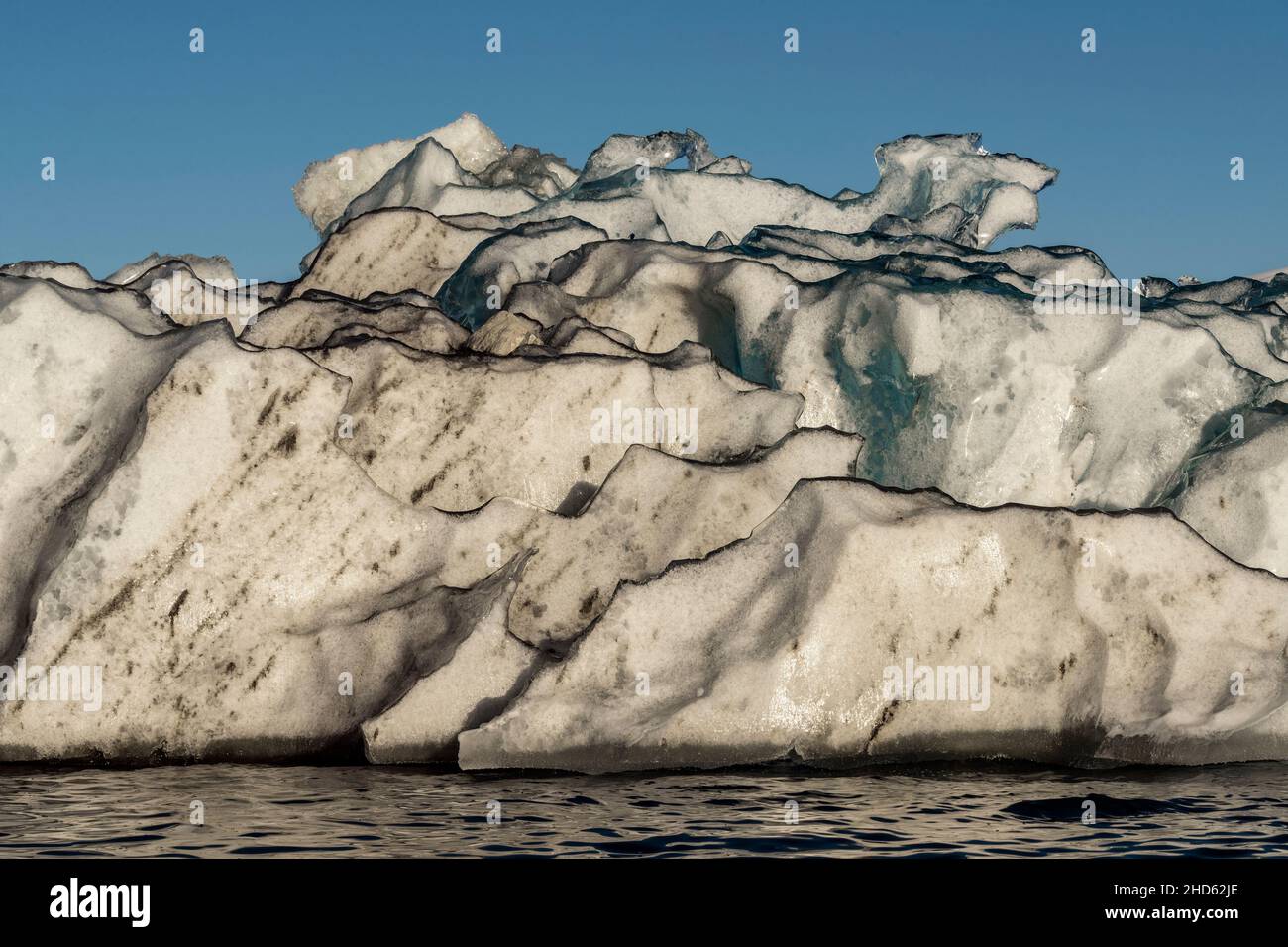 Black-rimmed iceberg close-up, Rodefjord, Scoresby Sund, East Greenland Stock Photo
