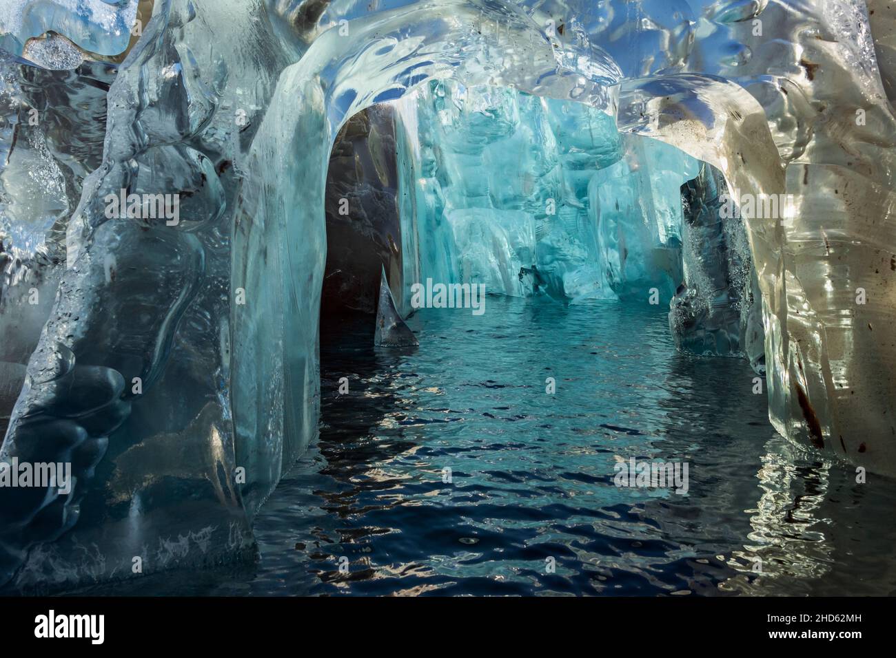 Crystal ice cave in an old highly compressed iceberg off Rolige Brae Glacier, Rodefjord, Scoresby Sund, Greenland Stock Photo