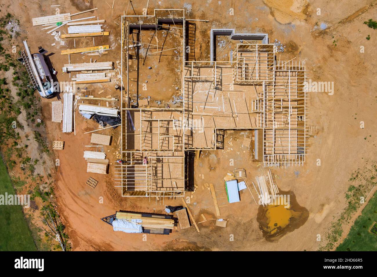 Aerial view of fragment a new home under construction wood framing beams framework Stock Photo