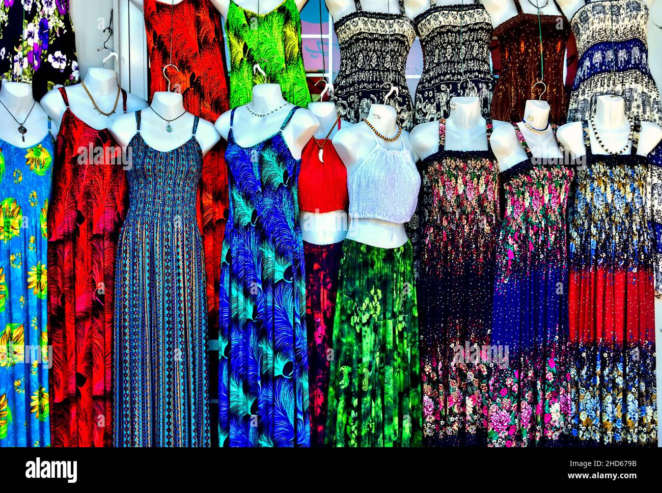 Colorful ladies dresses in a store front window on Vancouver Island British Columbia Canada Stock Photo