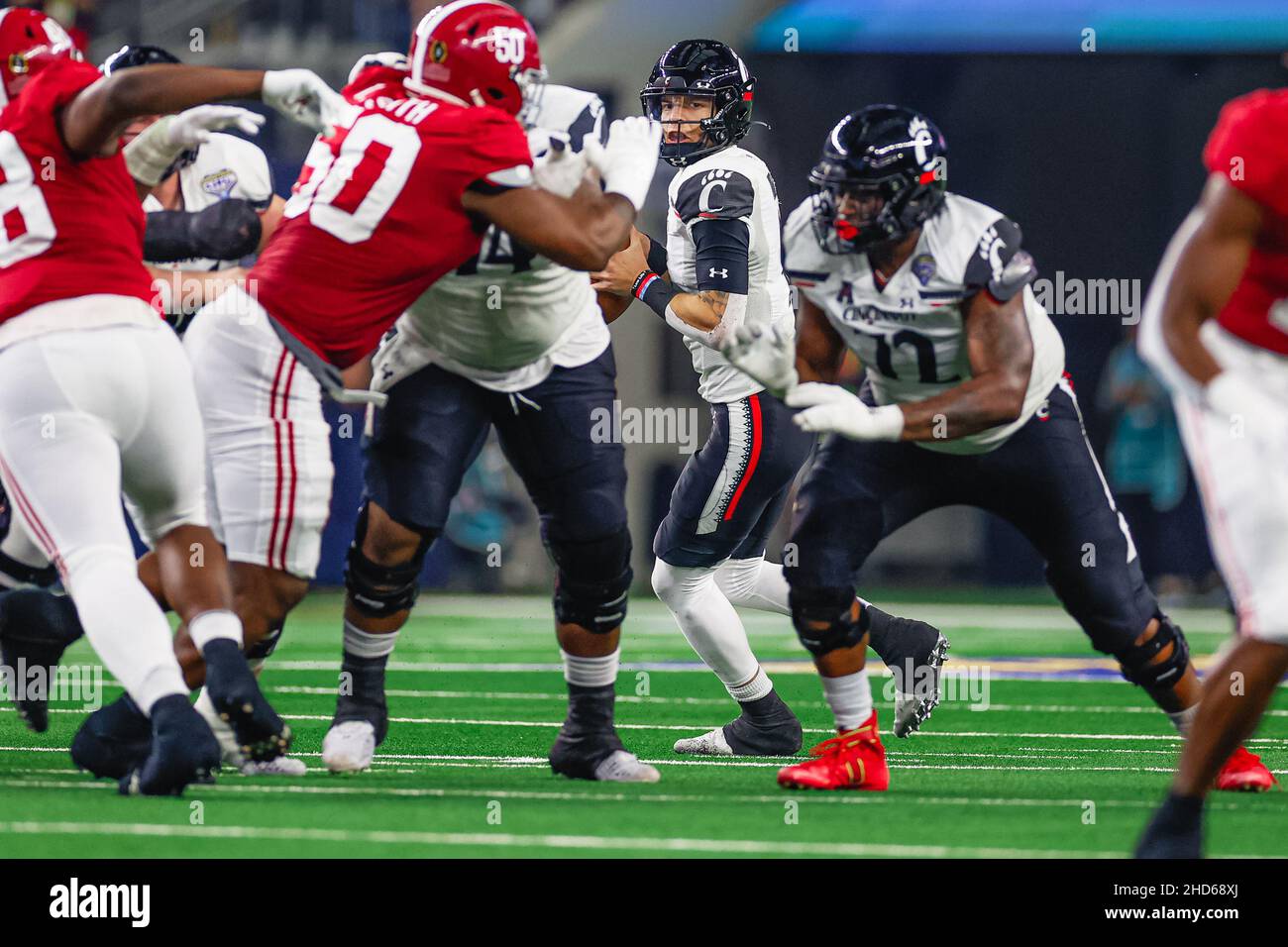 Cincinnati Bearcats quarterback Desmond Ridder (9) looks to pass the ball in the second half of an NCAA college football game against Alabama Crimson Stock Photo