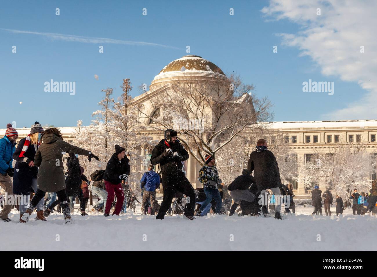 Washington, DC, USA, 3 January 2022.  Pictured: People engage in a huge snowball fight on the National Mall in front of the National Museum of Natural History after an unexpected snowstorm dumped roughly 8 inches on snow on Washington, DC.  The fight was announced by the DC Snowball Fight Association.  Credit: Allison Bailey / Alamy Live News Stock Photo