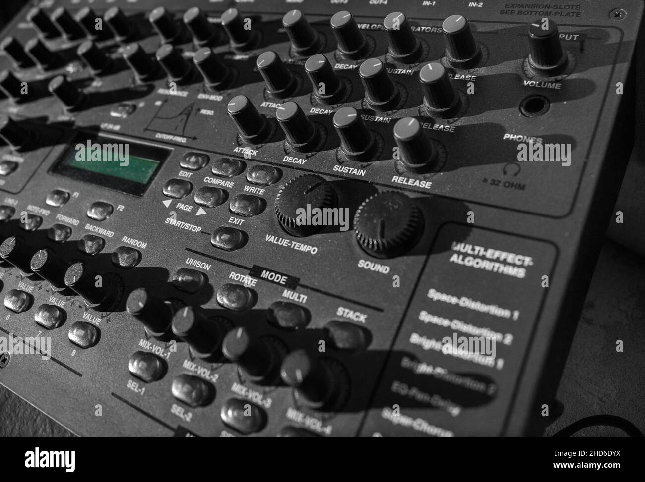 row of knobs on a desktop synthesizer, selective color closeup Stock Photo Alamy