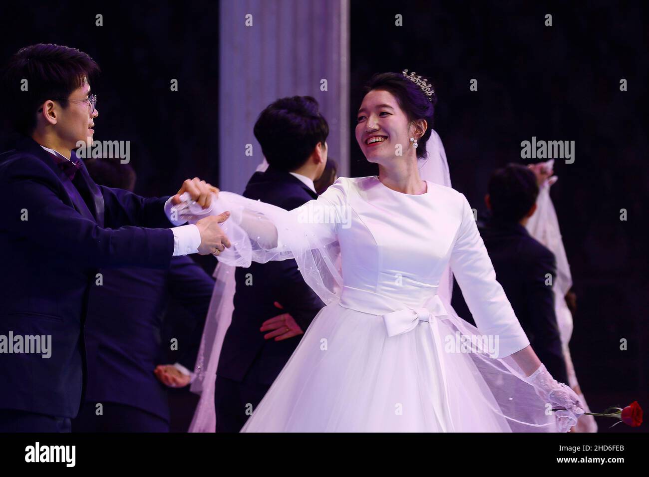 Feb 07, 2020-Gapyeong, South Korea-A Couple take part in a mass wedding of the Family Federation for World Peace and Unification, commonly known as the Unification Church, at Cheongshim Peace World Center in Gapyeong-gun, South Korea. Stock Photo