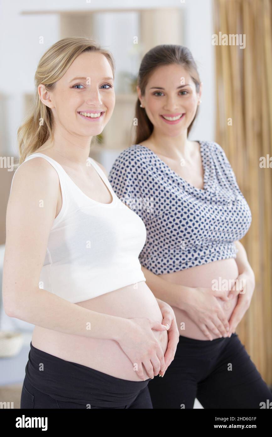 two pregnant women showing their bellies Stock Photo Alamy