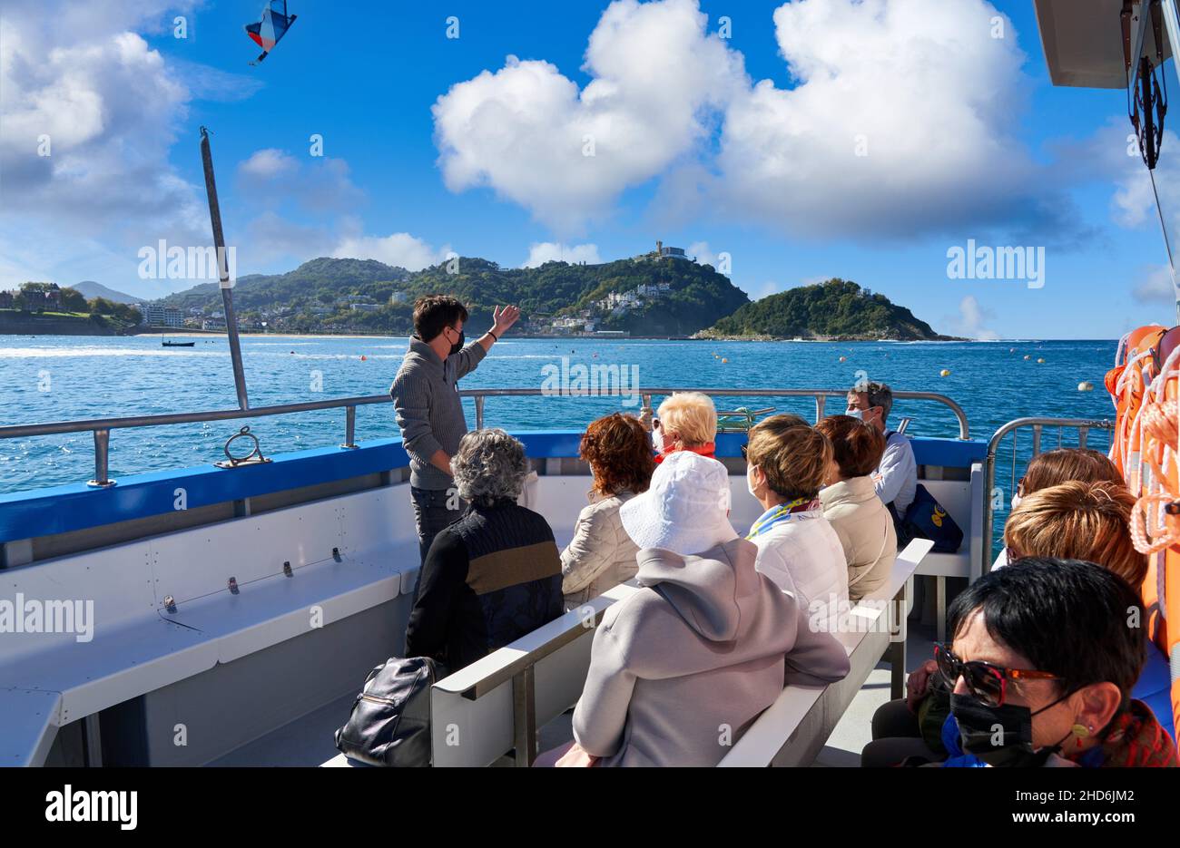 Tourist boat sailing through La Concha Bay, it is part of the excursion that takes place from Puerto Donostiarra to Santa Clara Island, where the Stock Photo