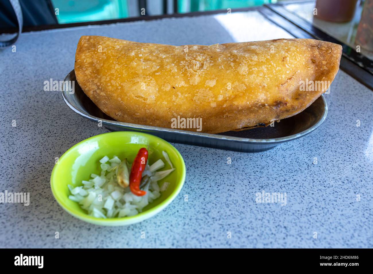 Popular Filipino snack empanada at the Restaurant Stock Photo
