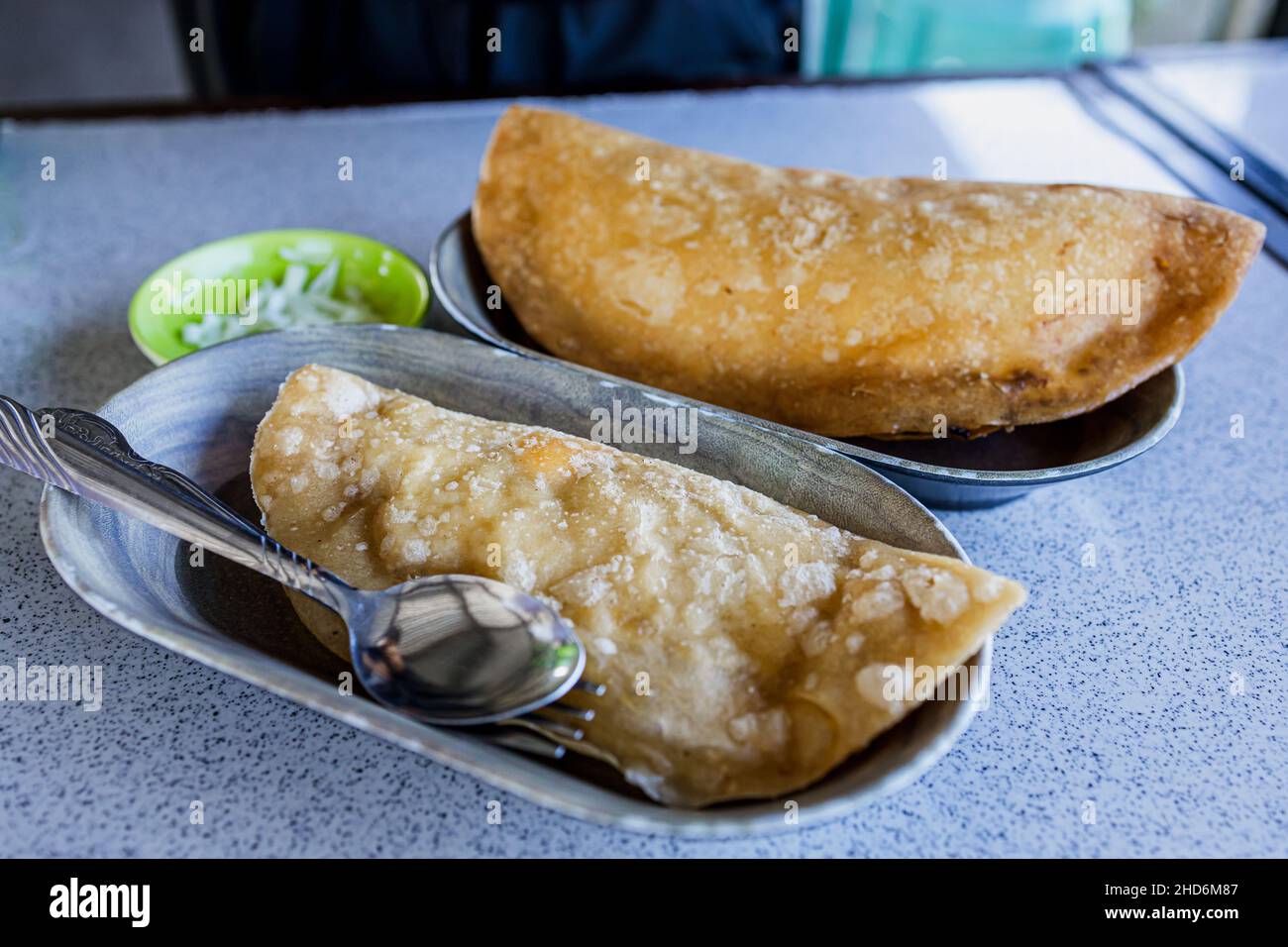 Popular Filipino snack empanada at the Restaurant Stock Photo